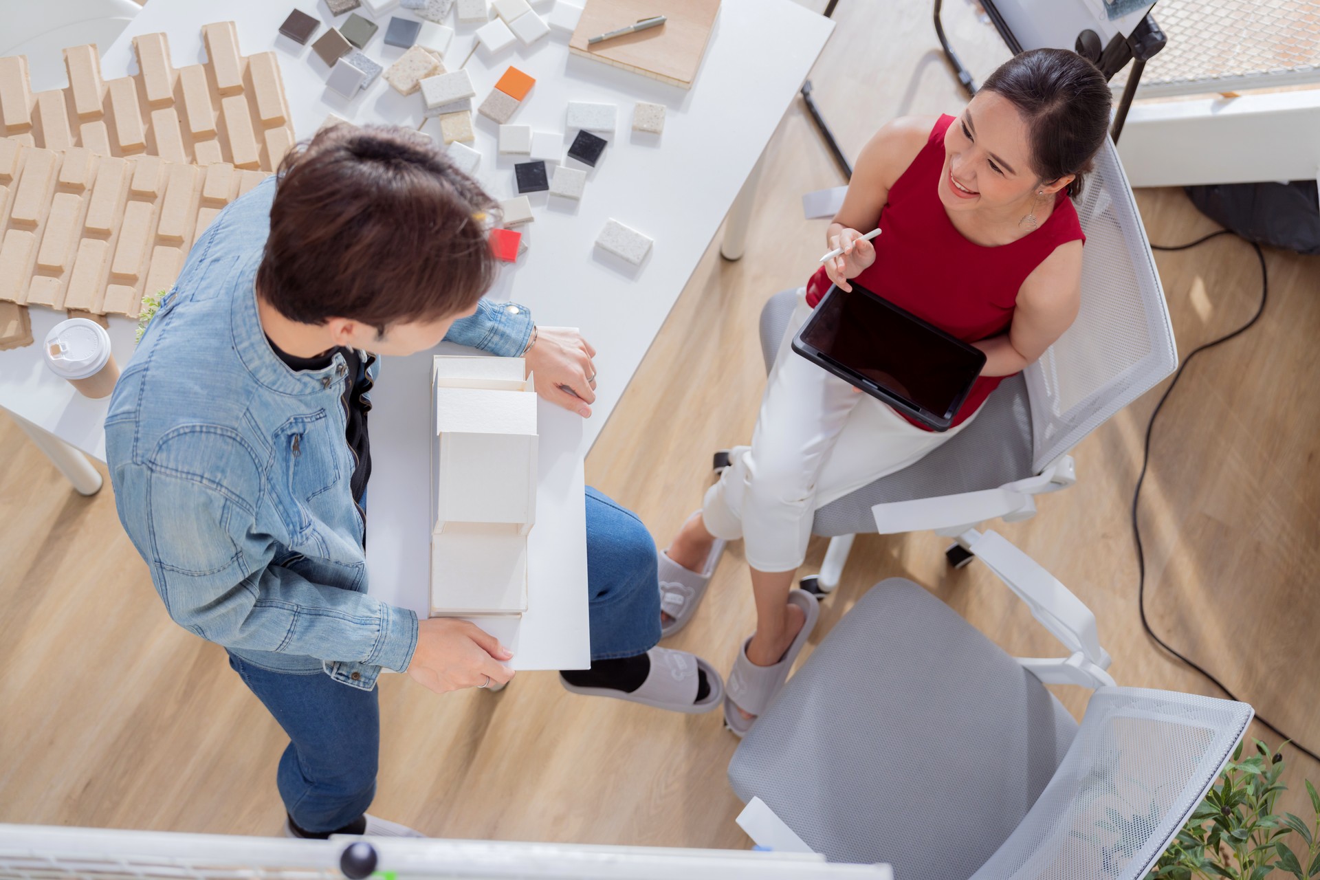 Meeting in a modern architectural office asian architect and interior designer working creative space planing design discuss brainstorm ideas sharing together Architect Team working best solution